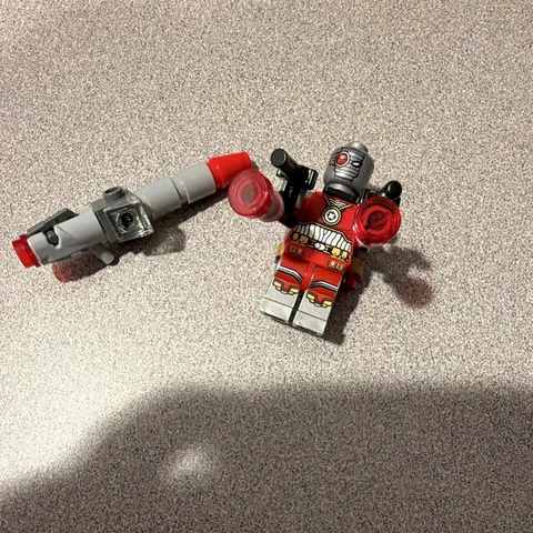 LEGO Deadshot Minifigure from set 76053  with original blaster and custom ones