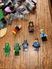 6 Lego Figures and 100+ Legos.  