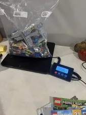 Lego random pieces 2.64 lbs plus set booklets shown in pictures