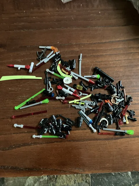Lego Massive Lot of Weapons. Star Wars Light Saber.  Ninjago. Etc.