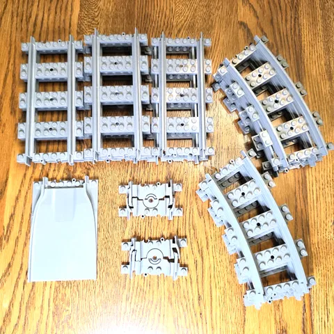 Lot of 16 Lego Train Track Pieces: 6 Curved, 7 Straight, 2 Flexible, 1 Ramp
