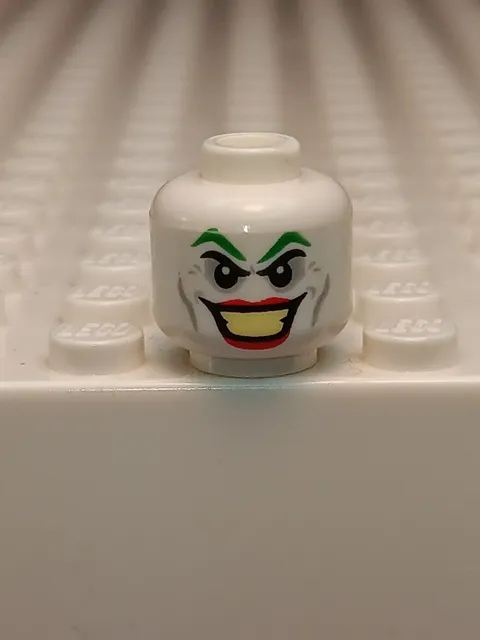 LEGO - Minifig, Head w/ Green Eyebrows, Cheek Lines & Red Lips (The Joker)
