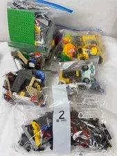 4lb Lot of Lego- Lego Parrot, Lego Bulldozer, Lego Random pieces, Tires, etc.