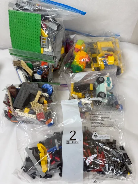 4lb Lot of Lego- Lego Parrot, Lego Bulldozer, Lego Random pieces, Tires, etc.