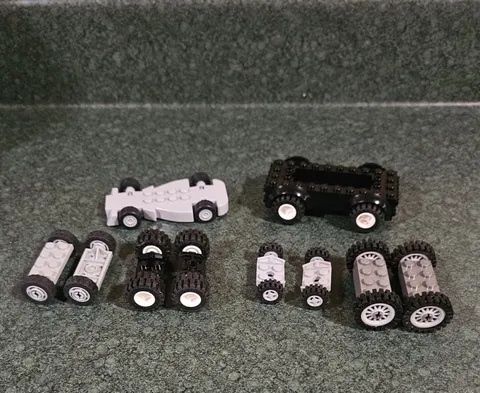 Lego Wheels Tires and Axles and chassis as shown assorted sizes.
