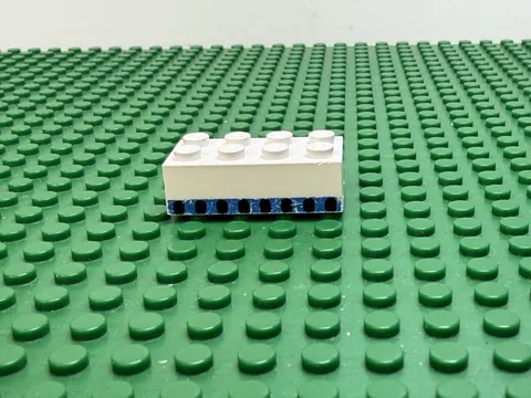 1976 LEGO White Brick 2x4 with 8 Plane Windows in Blue Stripe 1560 #3001oldpb03