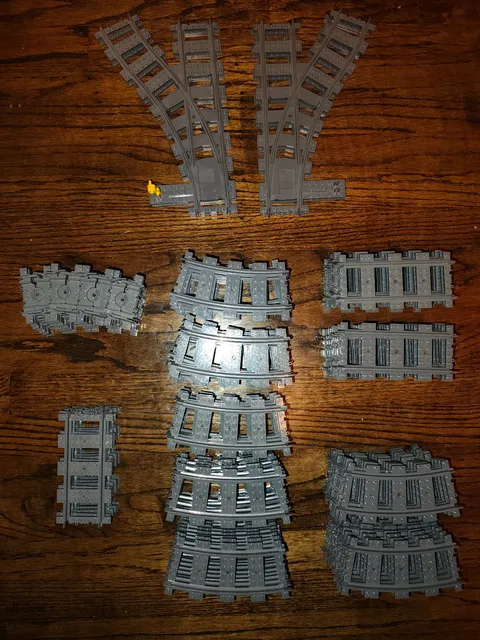 lot of 138 LEGO train tracks, 70 curved, 26 straight, 4 switches, 38 flex peices
