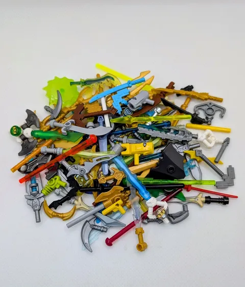 LEGO ® 50x weapons accessories mixed swords spears guns minifigures used