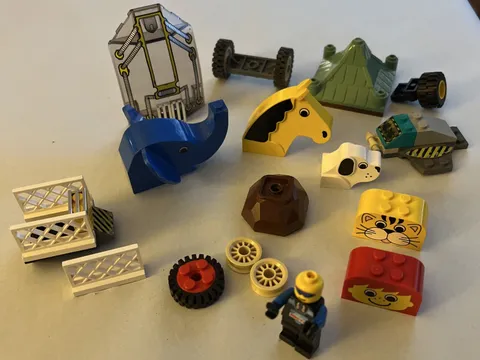 Various Lego Pieces And Characters  Dog , Horse, Elephant Head Etc