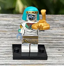 LEGO Minifigures Mummy Minifigure Teal Hood Gold Scarab Accessory Display Base