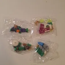 Lego Pieces 4 Bags Green & Purple Man & Castle With Trees & Others