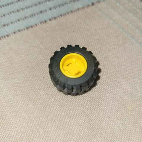  Lego parts... Yellow Wheel - 6014 and Black Tire - 87697