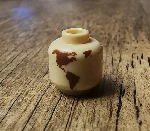 LEGO Tan Minifigure, Head with Reddish Brown Globe World Map. QTY 1. 3626pb2892