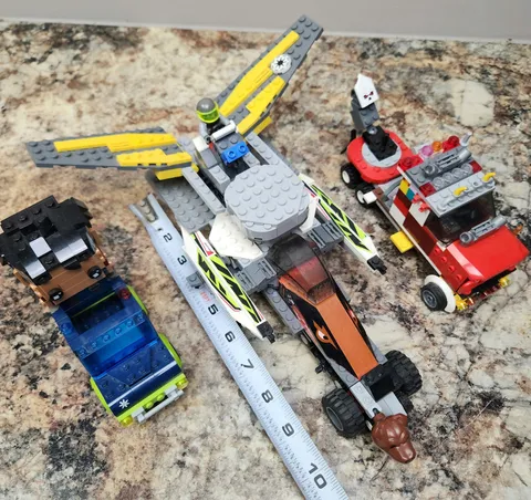 3 prebult lego trucks, block headz and Mini figure one is 11 inches long