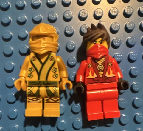 LEGO Ninjago Minifigures. Golden loyd and Kai. Comes with bow staffs