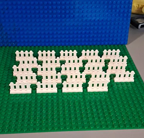 LEGO White Picket Fence (Part 33303), measuring 1 x 4 x 2 studs. 24 Pieces