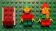 LEGO Lot of 2 Eleves wearing Green and Red outfits with sled included