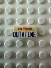 LEGO Tile 1 x 2 with Red and Dark Blue 'CALIFORNIA OUTATIME' 3069pb0288