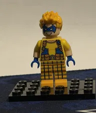 LEGO DC Trickster Minifigure Yellow Outfit, Blue Mask & Hands, Blond Hair