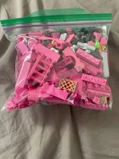 1/2 lb bag of random pink and black lego pieces - used pieces - random pieces