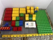 Lot of Vintage Lego Duplo 29 Pieces:  1 Figure, 1 Emt Car, 1-10x5  And 25 Blocks