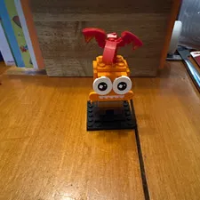 LEGO Orange Monster Creature Build with Red Wings on Black Baseplate