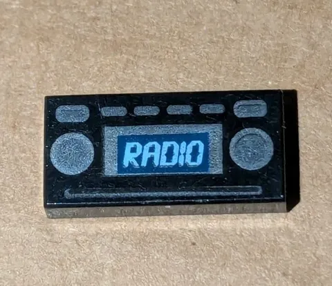 LEGO BLACK 1X2 TILE WITH LEGO MOVIE 70818 RADIO PATTERN PIECE PART # 3069pb0348