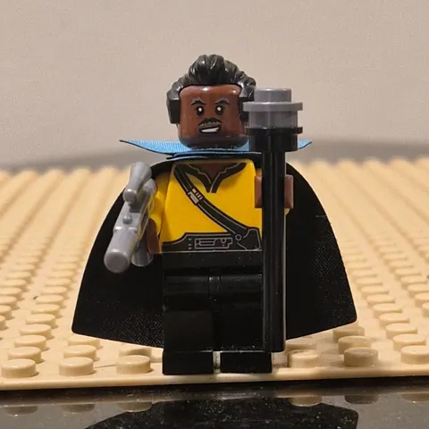 LEGO Minifigure Yellow Torso Black Hair Blue Cape with Blaster Accessory