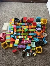 4.5 pounds of a Mixed lot of Duplo blocks with 4 figures boat bike fire truck