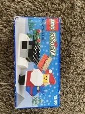 This Vintage LEGO System #1549 Santa and Chimney Set with Instructions