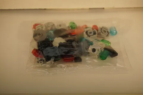 W - LEGO a Sealed bag of Misc bricks with small technical pieces. (#4545)