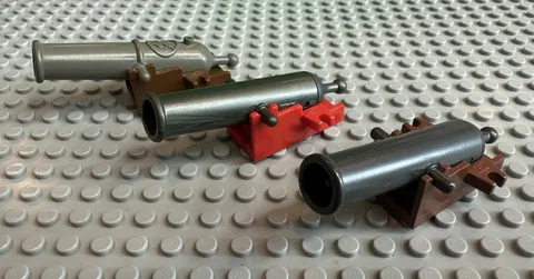 LOT OF 3 LEGO CANNONS & BASES.  WEAPON - 2 OF THEM ARE SHOOTING SPRING LOADED.