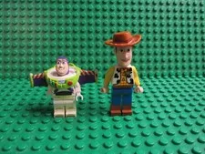 Lot 2 LEGO Disney Toy Story minifigs 7597 7590 7594 Sheriff Woody Buzz Lightyear