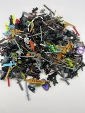 Lego Lot of Assorted Weapons. (Guns, Swords, Spears, bombs, Axes) 6 Ounces
