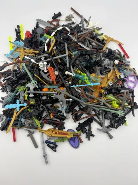 Lego Lot of Assorted Weapons. (Guns, Swords, Spears, bombs, Axes) 6 Ounces