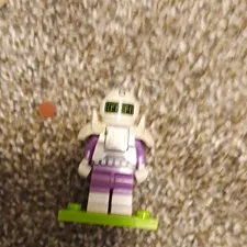 LEGO Minifigures Minifigure White Helmet with Purple Legs on Green Base