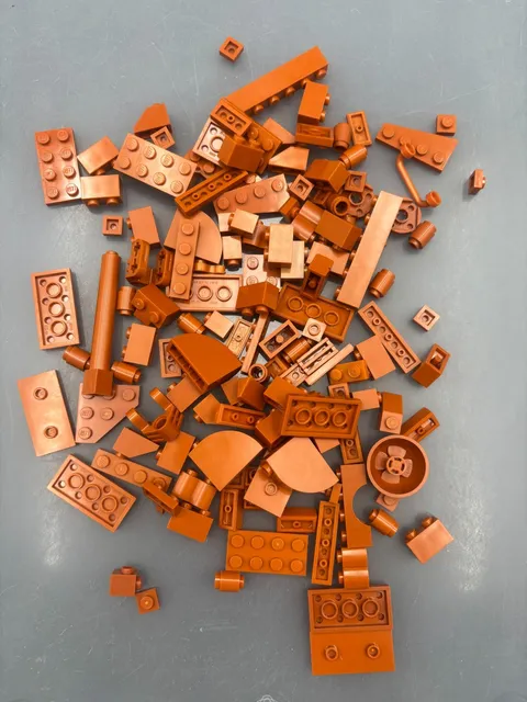 3 oz. Mixed Dark Orange Colored Legos - standard blocks and unique pieces