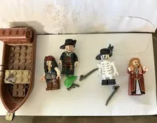 LEGO 4181 Pirates of the Caribbean Isla de Muerta loose figures and boat.