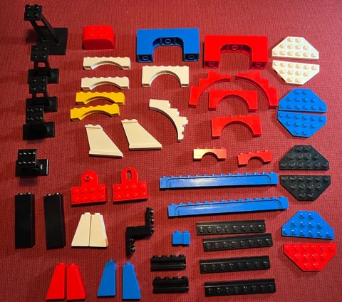 Lego lot of 50 assorted items: wedges, slopes, arches, grooved bricks, brackets