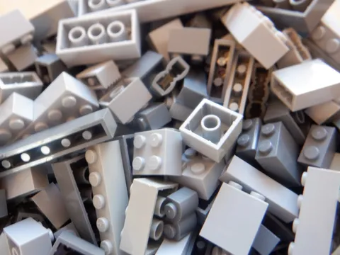 Bulk Legos sorted by color (white, red, green, blue, purple, etc.)