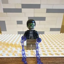 LEGO Minifigure Black Jacket Tan Legs Green Face Purple Chains Accessory