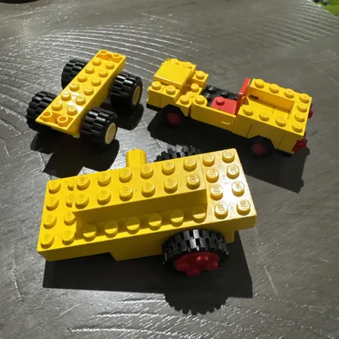 Lego, Vintage. Windup Motor 1980s with 2 Black Tire 24mm D. x 8mm. Yellow Fun!