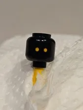 LEGO - Minifig, Head - Yellow Eyes with Small Black Dots Pattern (Jawa) - Black