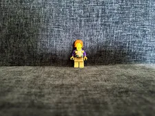 LEGO Plastic Minifigure with Orange/Red Hair, Purple Jacket & Tan Legs