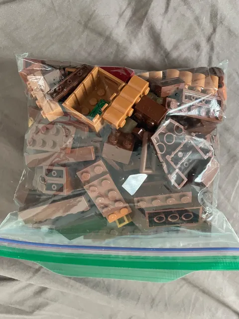 3 - 1/2 pound bags of brown lego pieces - used pieces - random pieces