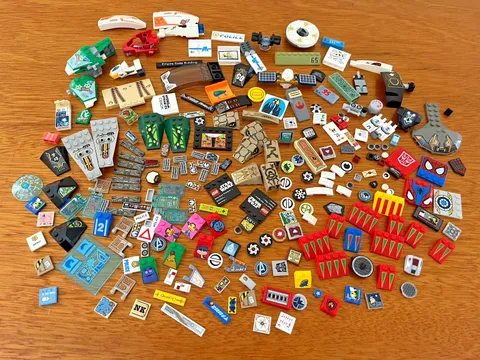 LEGO LOT OF 227 PRINTED AND STICKERED PARTS AND PIECES  - 11.5ozs.