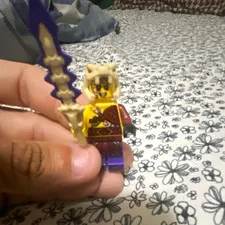 LEGO Minifigure Tan Animal Hood Purple Legs Skull Headpiece Purple/Gold Sword