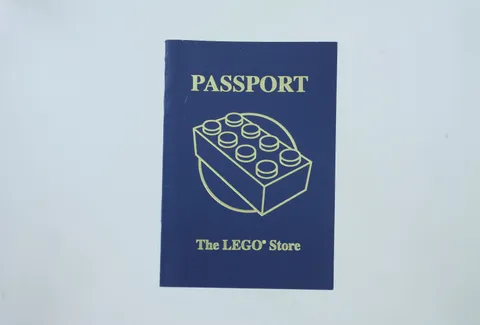 Lego Passport - The Lego Store - Blue Cover - has a few stamps