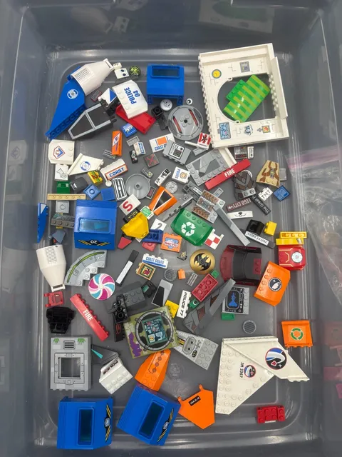 1 lb. Bulk LEGO pieces with stickers and painted on decals (Lot A)