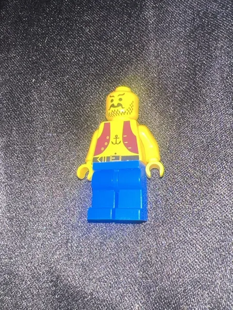 LEGO Pirates Minifigure, Pirate with Anchor Print on Maroon Vest/ Blue Legs
